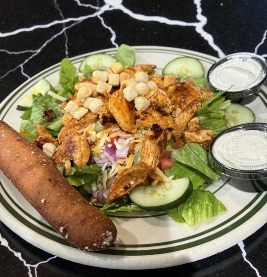 A fresh and flavorful take on a classic! Our crisp romaine Caesar salad comes with shredded Parmesan and croutons, and your choice of dressing on the side. The star of the show? Tender jumbo shrimp, seasoned and blackened or perfectly grilled. If you're in the mood for fried, we'll serve it with golden-fried popcorn shrimp! Served with a breadstick