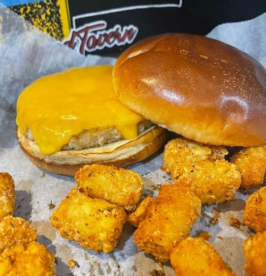 Our tender 1/3rd pound Jennie-O Ground Turkey Burger offers a delightful alternative to beef. Served on a soft brioche roll, complete with fresh lettuce, juicy tomato, and onion, plus your favorite cheese to finish it off.