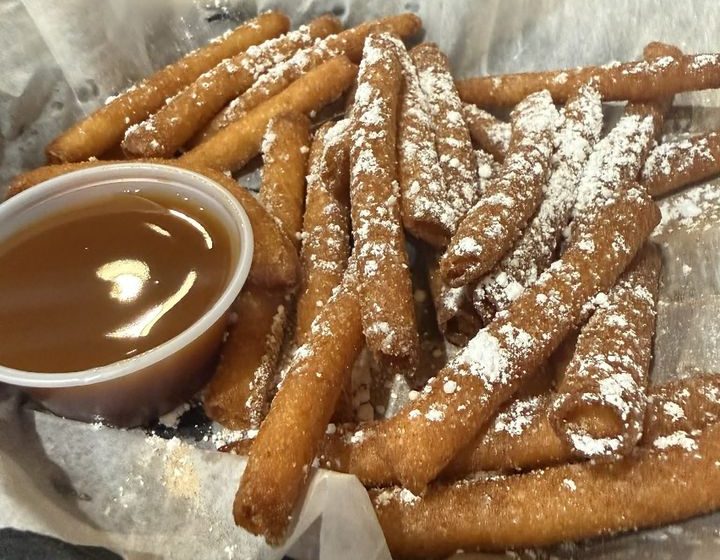 Indulge in a classic carnival treat, reimagined! Our lightly fried funnel cake sticks are perfectly golden and crispy, generously dusted with a delightful blend of cinnamon and sugar. A sweet, nostalgic bite in every stick! Served With Caramel Sauce.