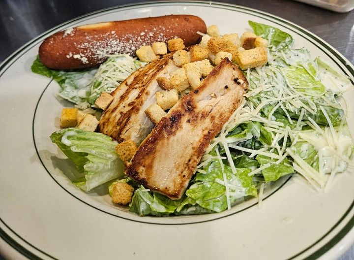 Indulge in our substantial Caesar salad, piled high with a delicious 1/2 pound of fresh Mahi Mahi. Choose your style – zesty blackened, tender grilled, or crispy fried – for a powerful protein punch that perfectly complements the creamy dressing, Parmesan, and croutons. Dressing and breadstick on the side.