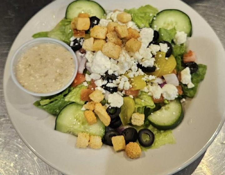 Our light and refreshing salad combines crisp romaine lettuce with creamy feta cheese, a kick from banana peppers, briny black olives, cool cucumber, sweet tomato, and crisp onion, topped with crunchy croutons. A perfect side or light meal. Greek Feta dressing on the side