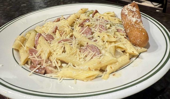 Andouille sausage, sautéed peppers and onions, garlic, and crushed red pepper, all enveloped in a rich cream and butter sauce with a sprinkle of shredded Parmesan cheese.